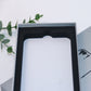White phone case packaging box with black molded tray and white insert