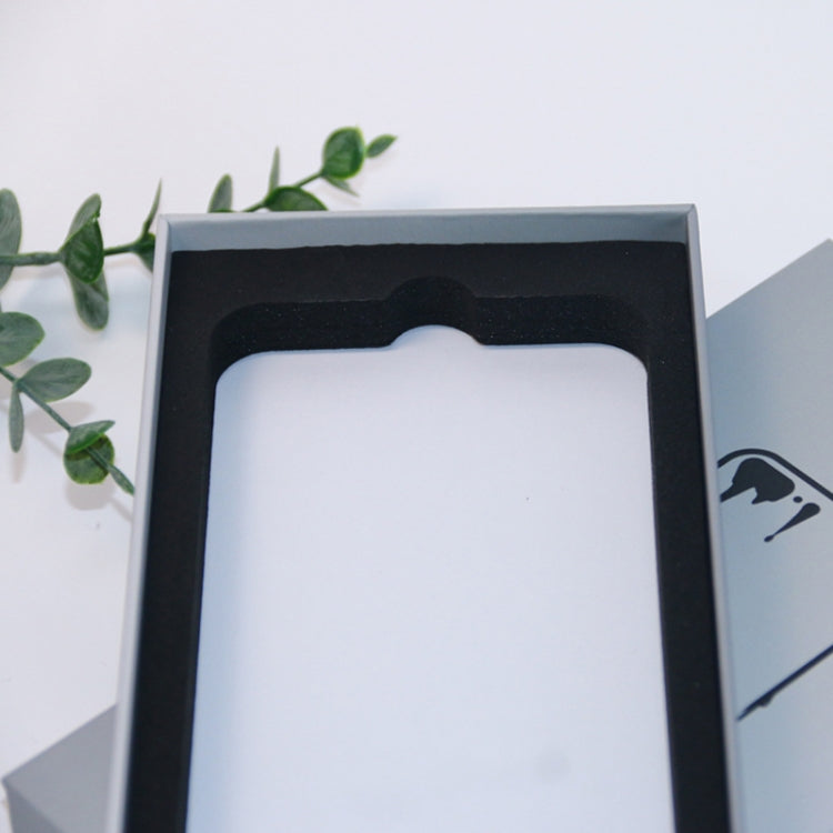 White phone case packaging box with black molded tray and white insert