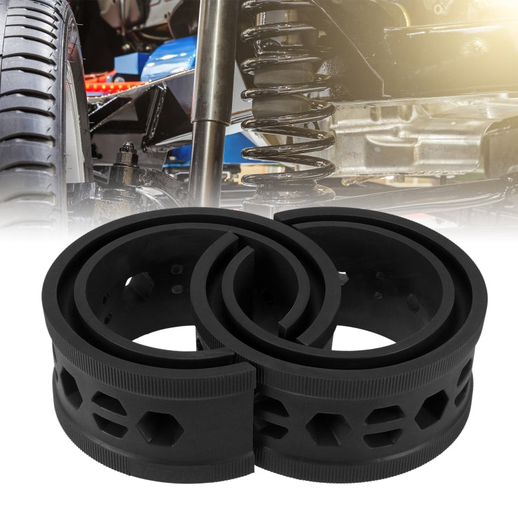 Black rubber spring shock buffer pair with raised rim and multiple side cutouts