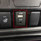 Car dashboard AUX and USB ports panel, with USB slot above AUX jack