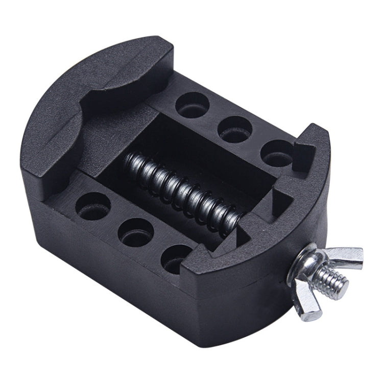 Black watch repair tool with spring clamp and circular adjustment holes