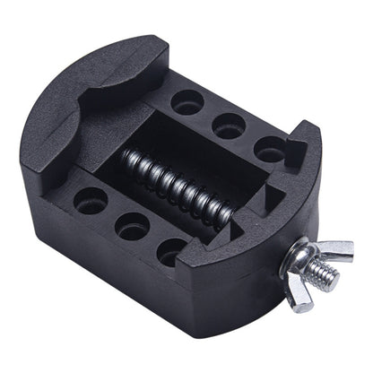 Black watch repair tool with spring clamp and circular adjustment holes