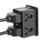 Dual USB port adapter block with two cable inputs and stacked port openings