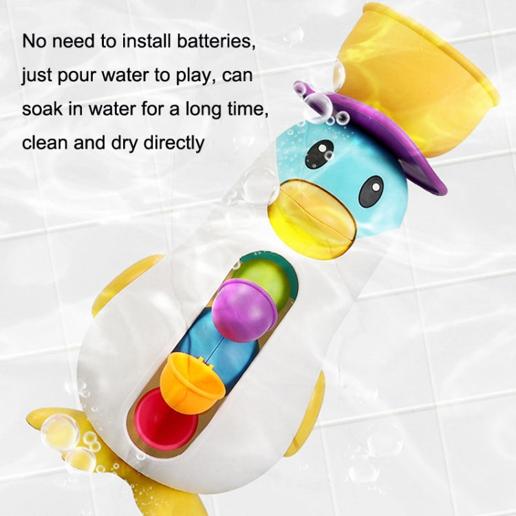 Baby penguin bath water toy with yellow top and three colored water cups