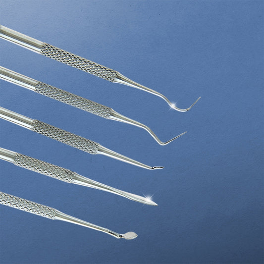 Stainless steel dental carving tools with angled pointed tips