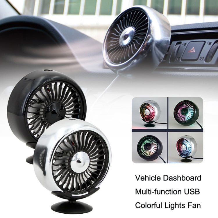 Dashboard USB fan with black and silver housings mounted on car dash