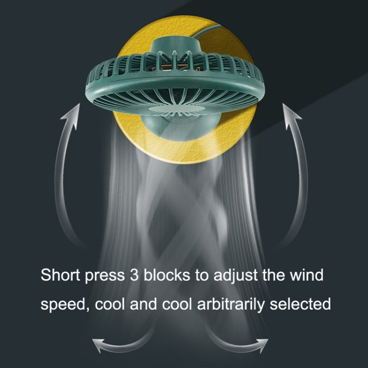 Green mini USB fan showing top air vents and airflow around the fan head