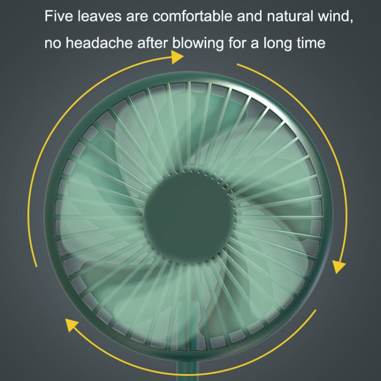 Green fan close-up with circular grille and visible blade spokes