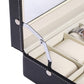 Black PU leather watch box with hinged lid, metal clasp, and compartment dividers