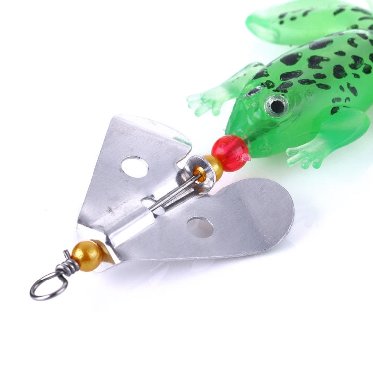 Close-up of green soft frog fishing lure with metal spinner blade and single hook