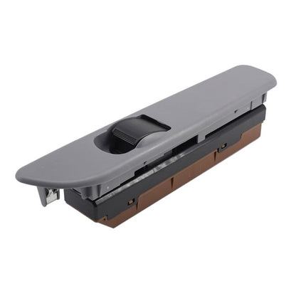 Grey power window switch panel with black switch button and control cutouts.
