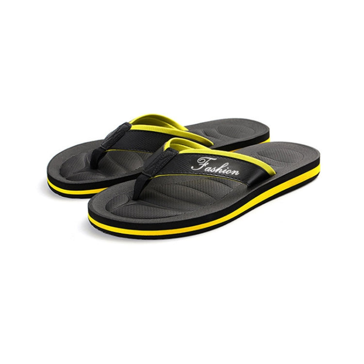 Pair of men's non-slip flip flops with black straps and yellow-edged soles
