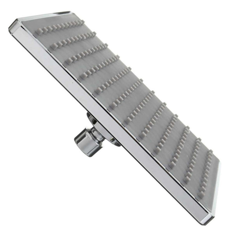 Slim side view of chrome square shower head with wall connection and nozzle panel