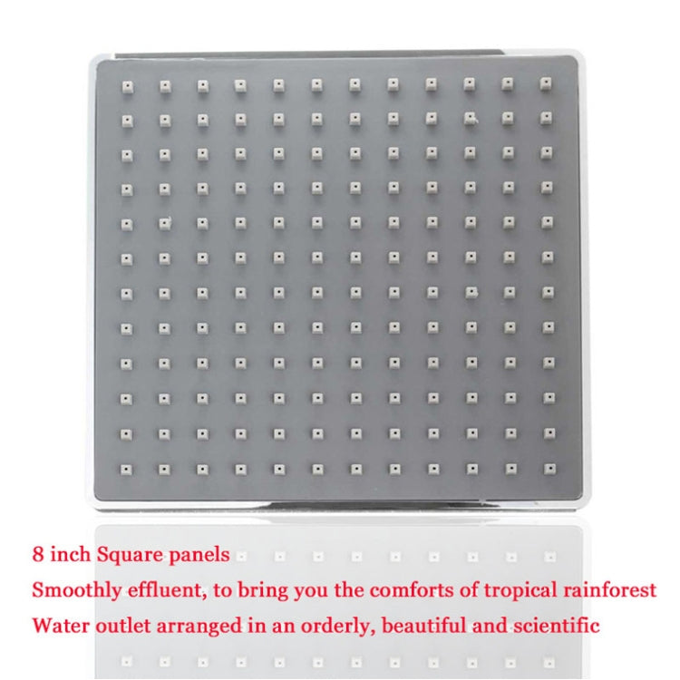 Square shower head panel featuring a grid of small chrome spray nozzles
