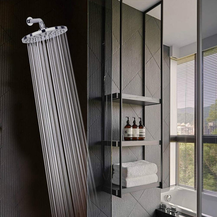 Wall-mounted chrome rain shower head with steady vertical spray streams