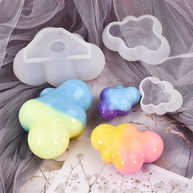 Cloud-shaped silicone molds with colorful cast pieces and small cavities