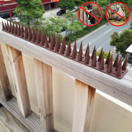 Plastic anti-climb fence spikes, brown upright needle points