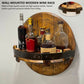 Round wooden wall-mounted wine rack with black leather strap and bottle compartments.