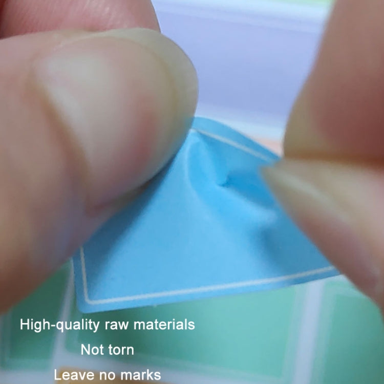 Children's square label stickers, close-up of hands peeling a blue square