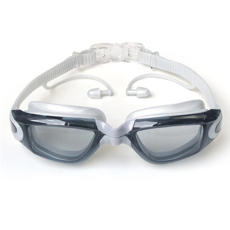 Anti-fog swim goggles with clear frame, tinted lenses, and adjustable strap