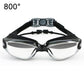 Swimming goggles with clear lenses, black headband, and reflective gray frame