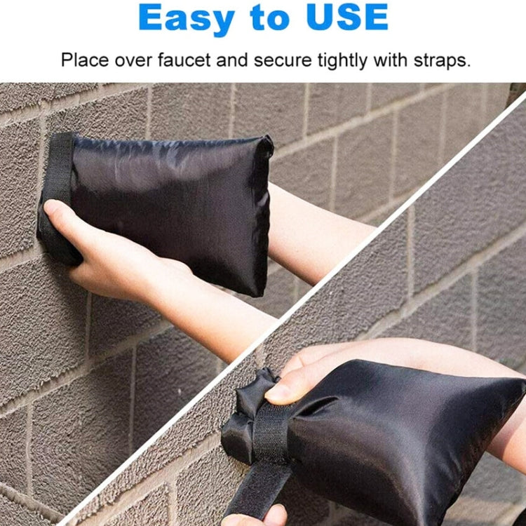 Black faucet frost cover secured by straps over outdoor spigot