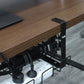 Under-desk cable management tray with black side brackets and wire rack