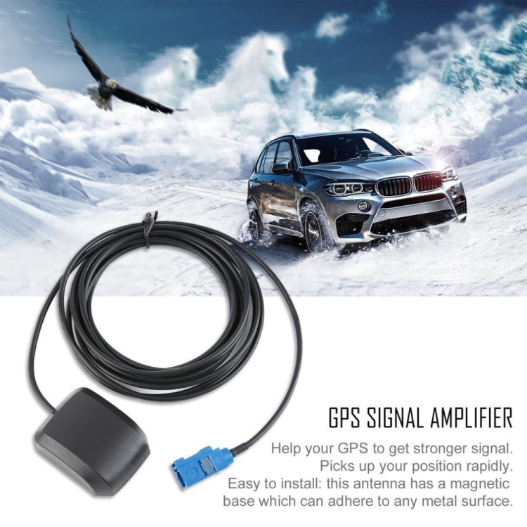 GPS signal amplifier set with black cable, square base, and blue connector; adheres to metal.