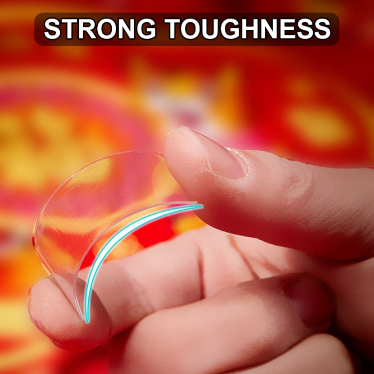 Hands holding a clear tape strip with curved edge, double-sided sticker