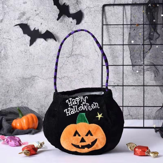 Black Halloween candy cloth bag with “Happy Halloween” and jack-o’-lantern applique