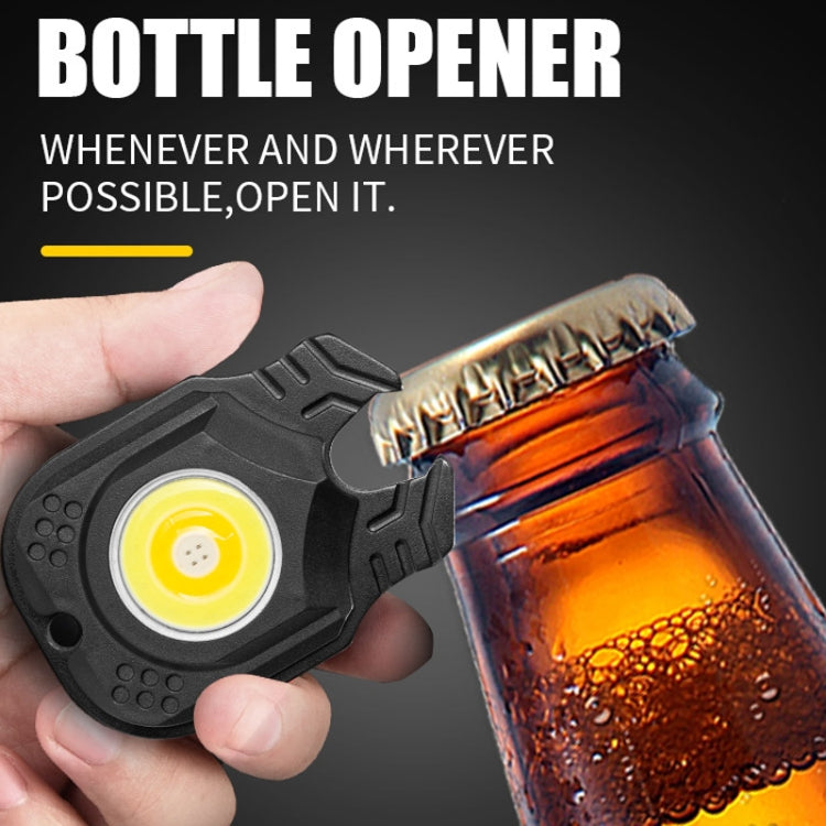 Mini flashlight with bottle opener end, black body, COB lens, and red side switch