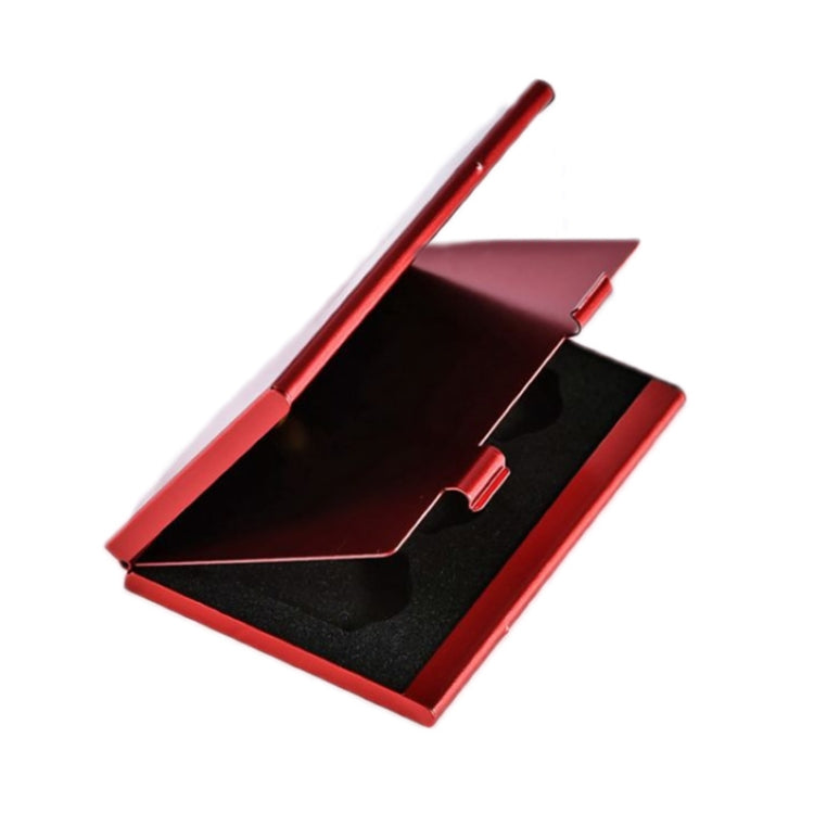 Red aluminum game card storage case open, black insert and card slot compartments visible