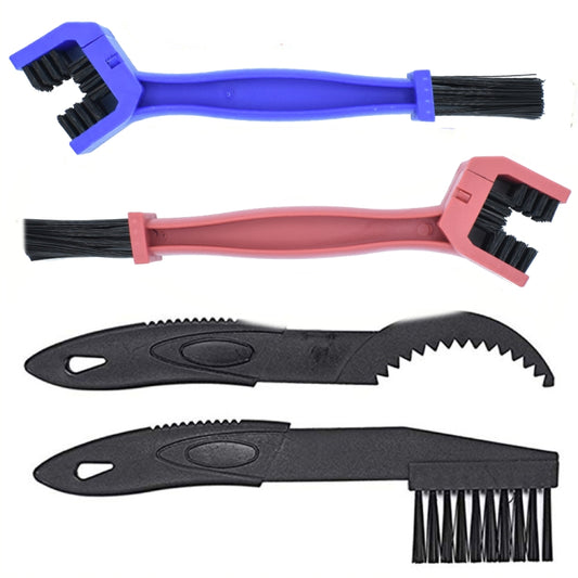 Bike chain cleaning kit with blue and pink brushes, chain scraper tools, and handle brushes
