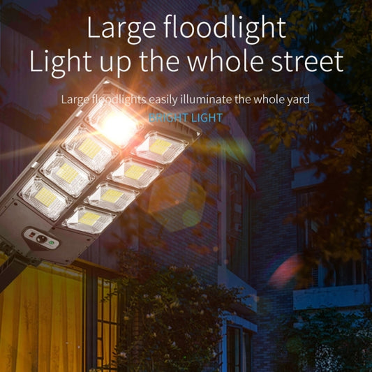 Solar LED road light head mounted on a pole, shown in evening street lighting