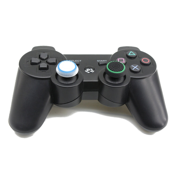 Gamepad with installed silicone luminous thumbstick caps, blue and green