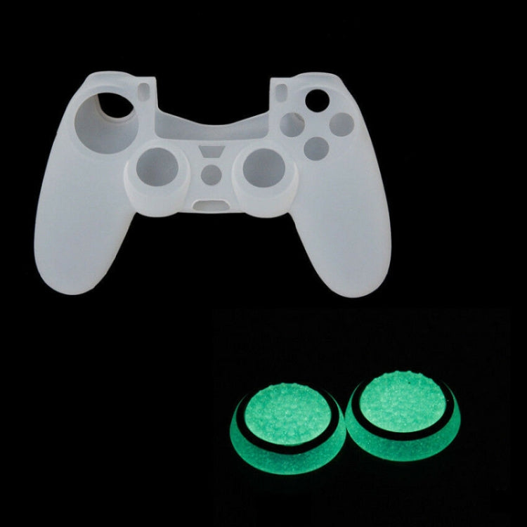Pair of glowing green silicone thumbstick caps on a white game controller