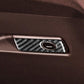 Installed glove box handle sticker with carbon-fiber pattern and round silver-rim insert