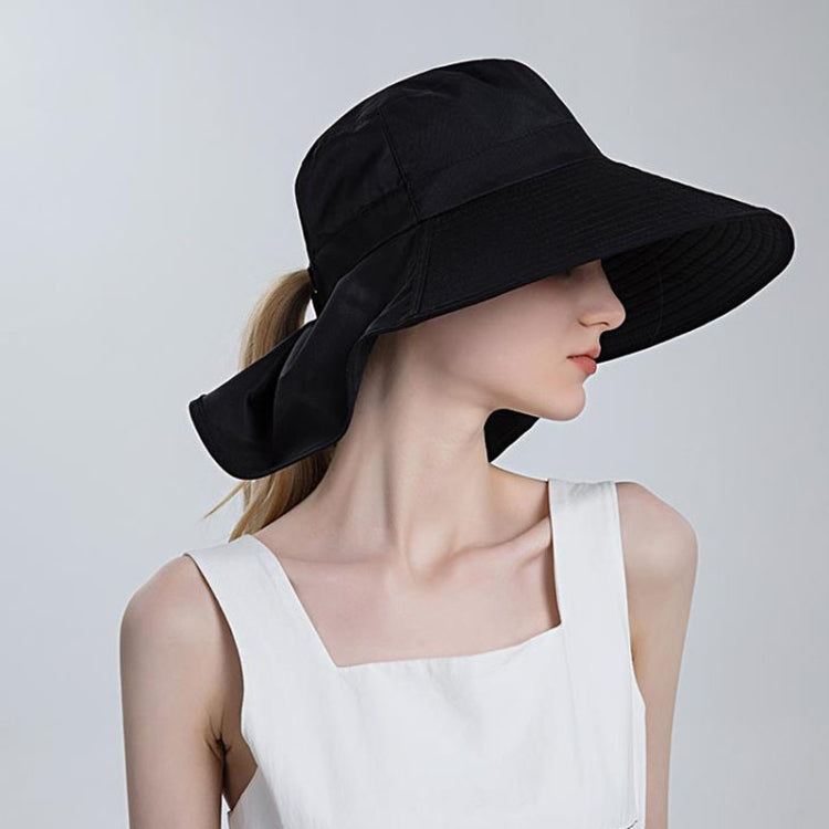 Black large-brim ponytail bucket hat with back ponytail flap and chin tie.