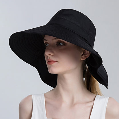 Black large-brim ponytail bucket hat with wide flared crown and side flap.