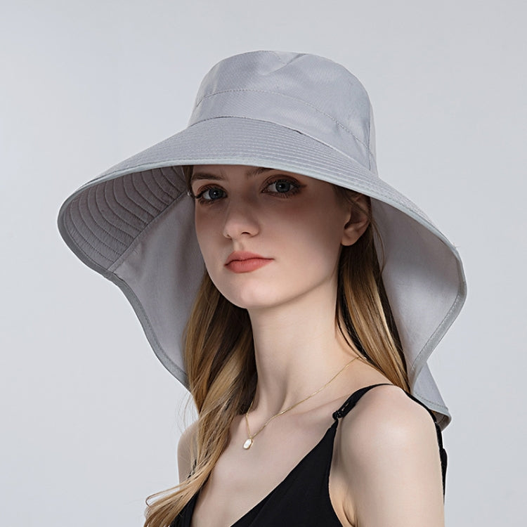 Light gray large-brim bucket hat with chin tie and wide flared brim.