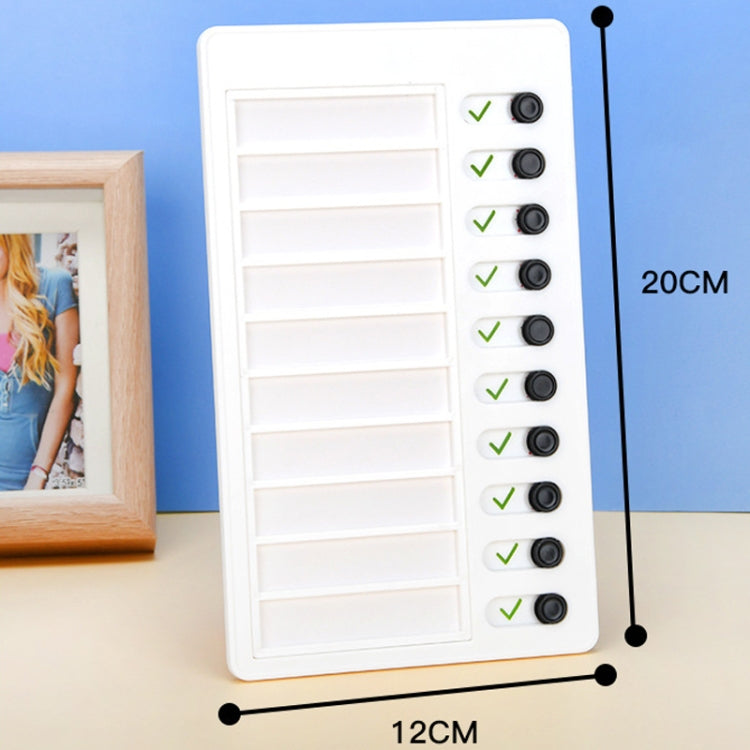 White wall checklist memo board with hanging hook, card slots, and black round buttons