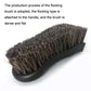 Black handled brush with dense, flat brown bristle head for car interior cleaning