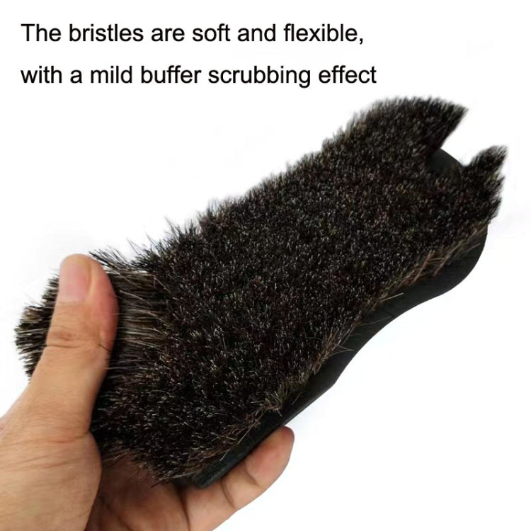 Close-up of black brush head with soft, flexible brown bristles for detailing