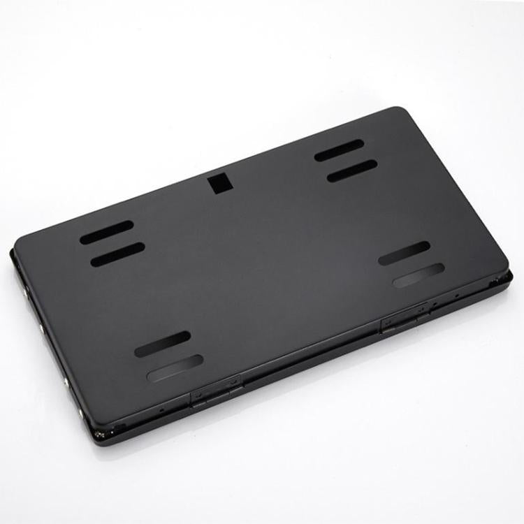 Black license plate bracket with perforated mounting slots and rear mounting tabs