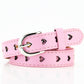 Pink women’s belt with heart cutouts and silver buckle