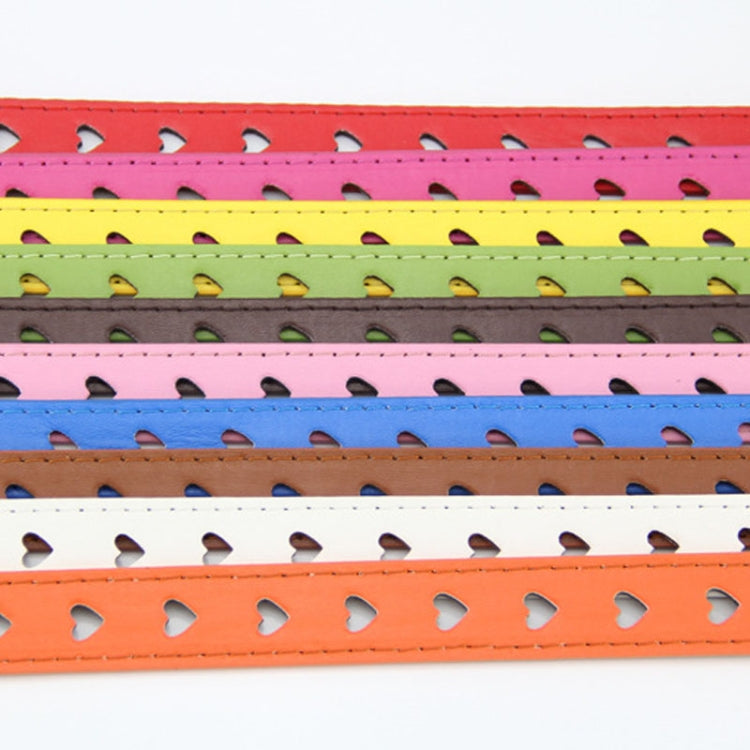 Close-up of heart cutout holes on a colorful pinching belt strap with stitching