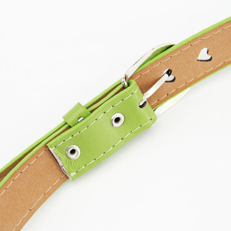 Green leather belt end with heart cutouts, metal eyelets, and stitched keeper tab