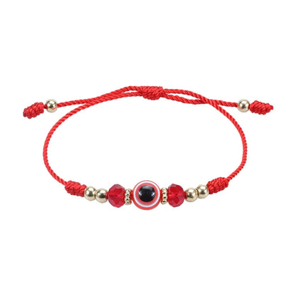 Red braided adjustable bracelet with evil-eye charm and faceted crystal beads