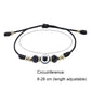 Black braided adjustable bracelet with round evil-eye bead and faceted crystal beads