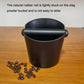 Coffee grounds bucket with dark brown body and black lid, side handles